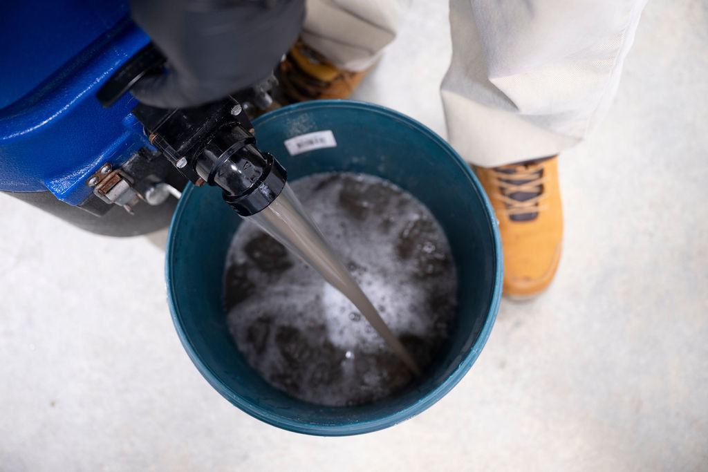 Dirty water extracted from a carpet during a professional carpet clean